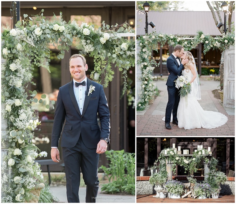 Archway with vintage door and mantle covered in greenery and candles